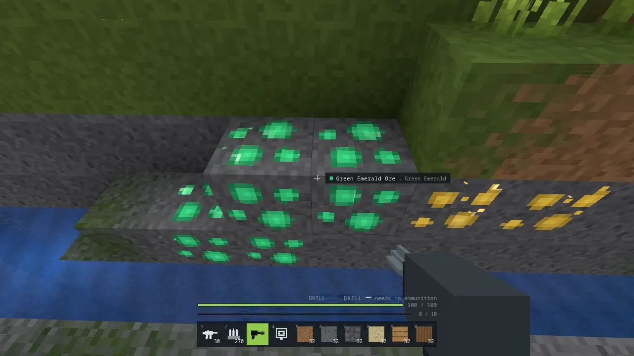 Aiming the Drill at green emerald ore in a rock face, with a label beside the crosshair reading Green Emerald Ore, gives Green Emerald, and gold ore to the right